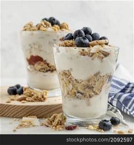 front view glasses with yogurt breakfast cereals