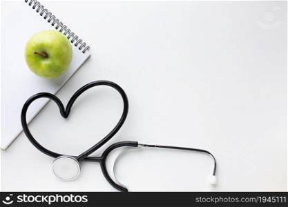 front view green apple stethoscope. High resolution photo. front view green apple stethoscope. High quality photo