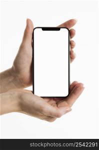 front view hands holding smartphone with blank screen