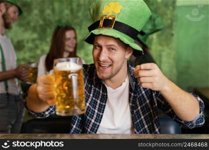 front view happy man with hat celebrating st patrick s day bar