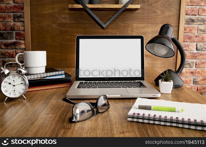 front view laptop lamp wooden office workspace. High resolution photo. front view laptop lamp wooden office workspace. High quality photo