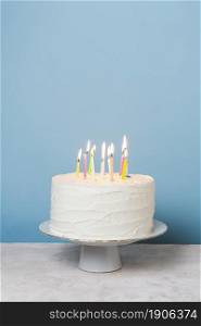 front view lit candles birthday cake. High resolution photo. front view lit candles birthday cake. High quality photo
