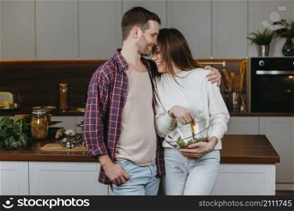 front view loving couple preparing food home