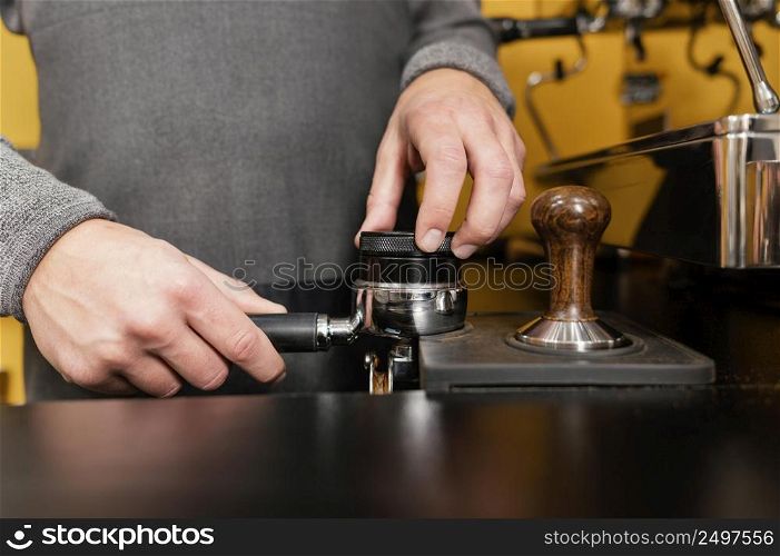 front view male barista using professional coffee machine cup