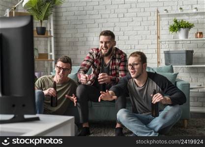 front view male friends watching sports together tv