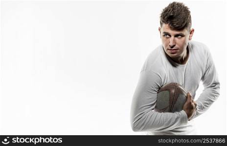 front view male rugby player posing with ball copy space