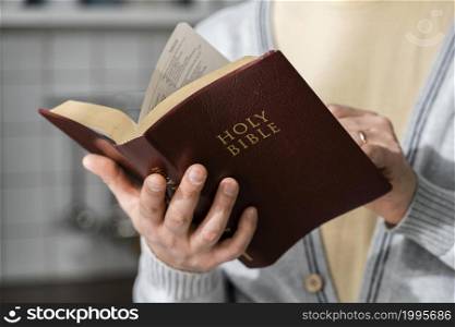 front view man holding bible