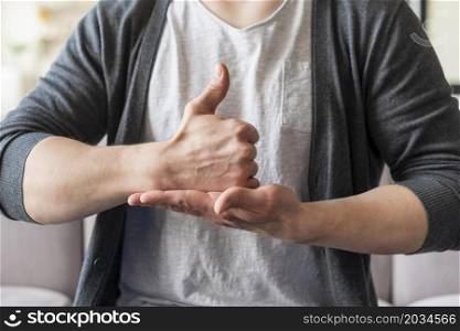 front view man using sign language