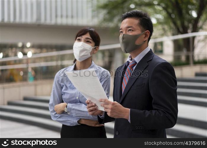 front view man woman wearing face mask