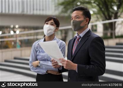 front view man woman wearing face mask