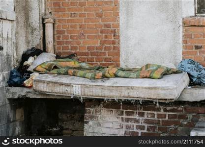 front view mattress blanket homeless people