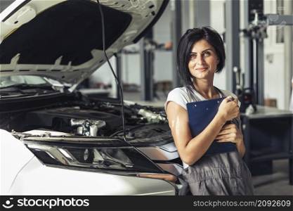 front view mechanic woman with clipboard