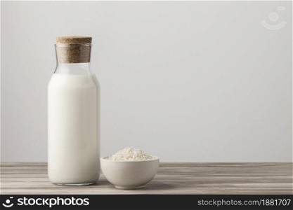 front view milk bottle with rice copy space