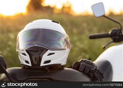 front view motorcycle helmet sitting bike. High resolution photo. front view motorcycle helmet sitting bike. High quality photo