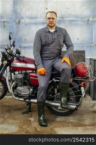 front view motorcycle mechanic with protective glasses