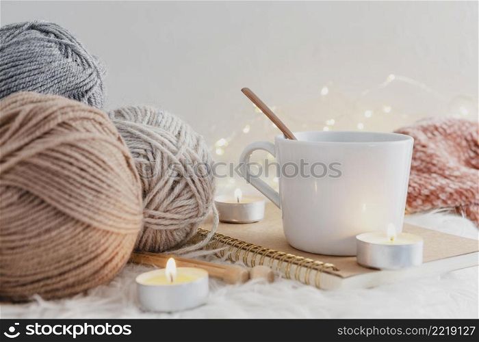 front view mug with candles yarn