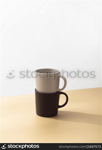 front view mugs stacked with copy space