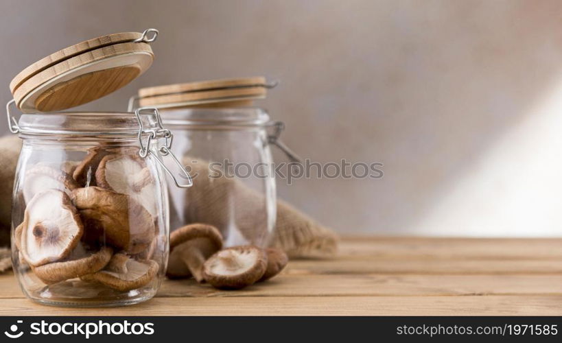 front view mushrooms clear jars. High resolution photo. front view mushrooms clear jars. High quality photo