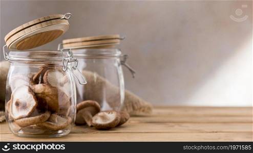 front view mushrooms clear jars. High resolution photo. front view mushrooms clear jars. High quality photo