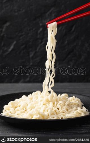 front view noodles chopsticks plate