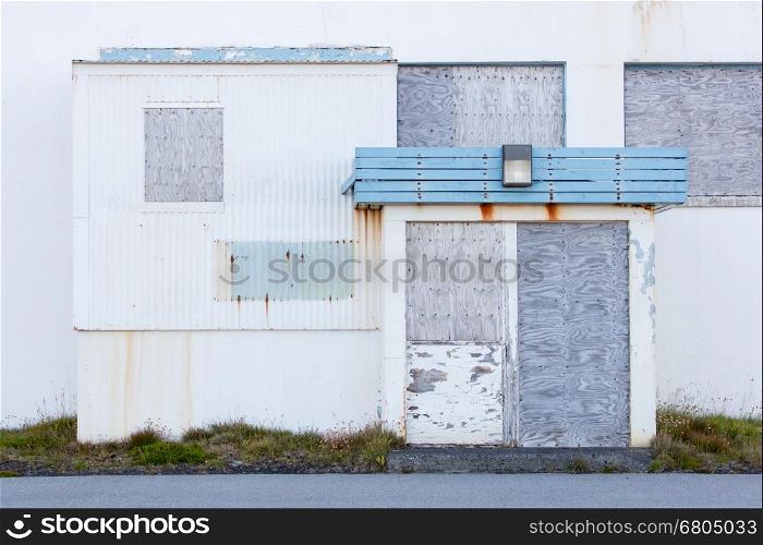 Front view of a boarded-up abandoned building in Iceland - Old USAF base