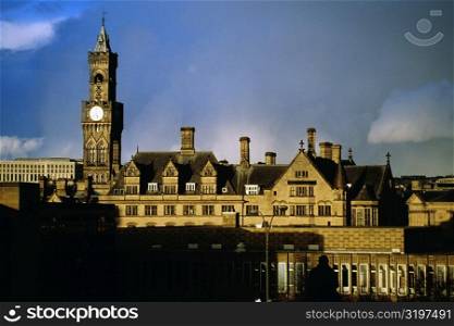 Front view of a clock tower on a cloudy day, Bradford, England