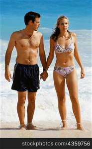 Front view of a couple in swimsuit, Horse-shoe Bay beach, Bermuda