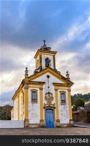 Front view of a historic baroque church in the old town of Ouro Preto in Minas Gerais. View of a historic baroque church