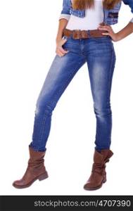 Front view of a standing woman model wearing denim with boots isolated on a white background