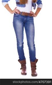 Front view of a standing woman model wearing denim with boots isolated on a white background
