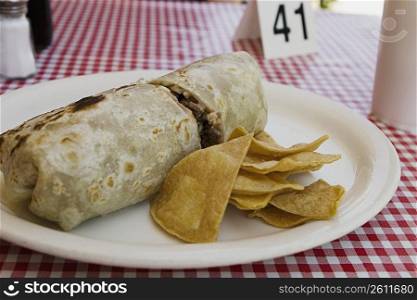 Front view of burrito and chips