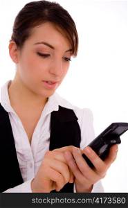 front view of female executive using cellphone against white background
