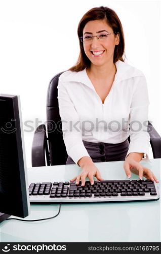 front view of female working on computer against white background