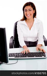 front view of female working on computer against white background
