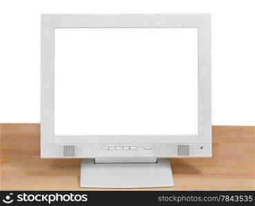front view of grey computer display with cut out screen on wooden table isolated on white background