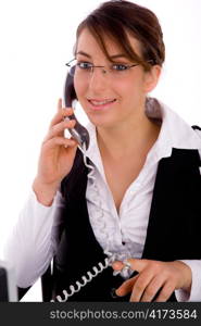 front view of happy female lawyer communicating on phone with white background