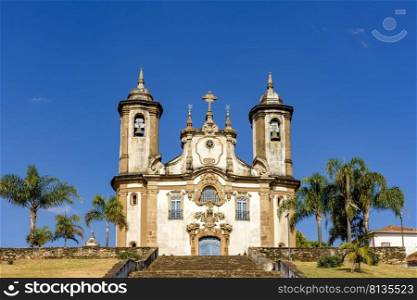 Front view of historic 18th century church in colonial architecture in the city of Ouro Preto in Minas Gerais, Brazil. Facade of historic 18th century church in colonial architecture