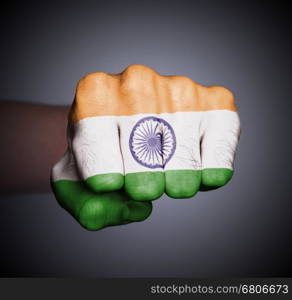 Front view of punching fist on gray background, flag of India