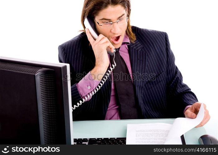 front view of shocked professional talking on phone on an isolated white background