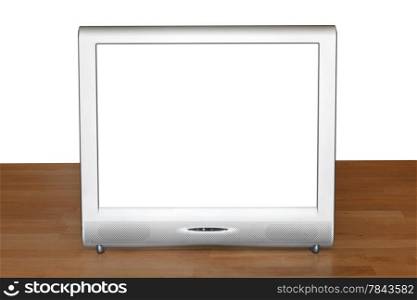 front view of silver TV set display with cutout screen on wood table isolated on white background