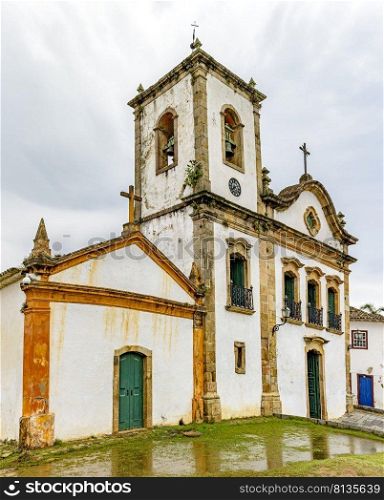 Front view of the facade of a historic church in the city of Paraty on the south coast of Rio de Janeiro. View of the facade of a historic church in the city of Paraty