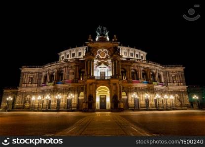 Front view of the Semperoper (Opera house) in Dresden at night, home to the ballet and the Saxon State Orchestra.