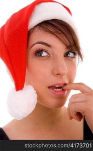 front view of thinking woman in christmas hat on an isolated background
