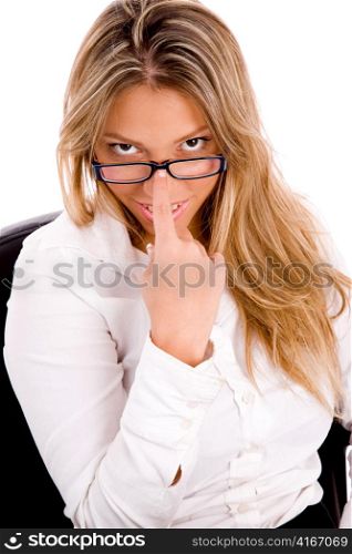 front view of young lawyer holding eyewear against white background