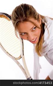 front view of young tennis player with racket on an isolated background