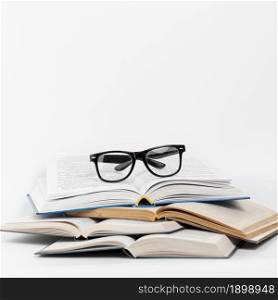 front view open books with glasses. Resolution and high quality beautiful photo. front view open books with glasses. High quality beautiful photo concept