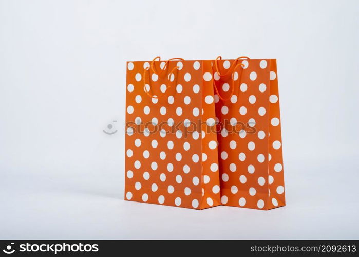 front view orange bags with white dots