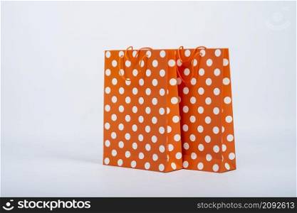 front view orange bags with white dots