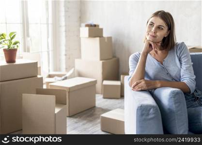 front view pensive woman couch ready move out