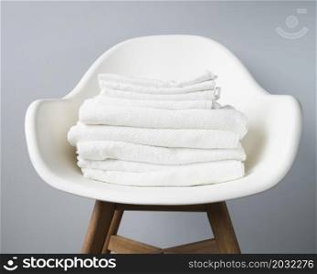front view pile towels chair